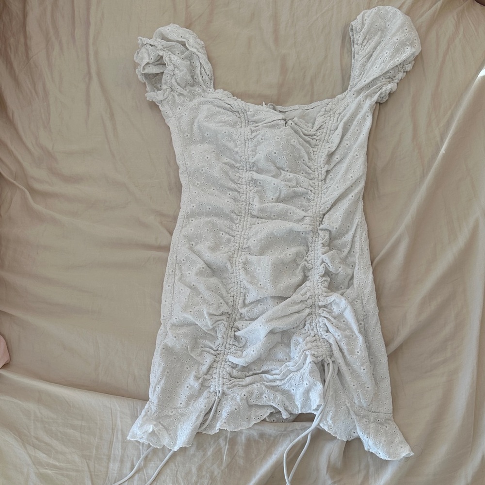Chic White Ruched Mini Dress with Eyelet Accents